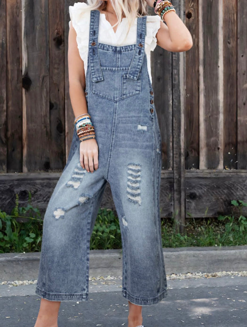 Distressed wide legged overalls