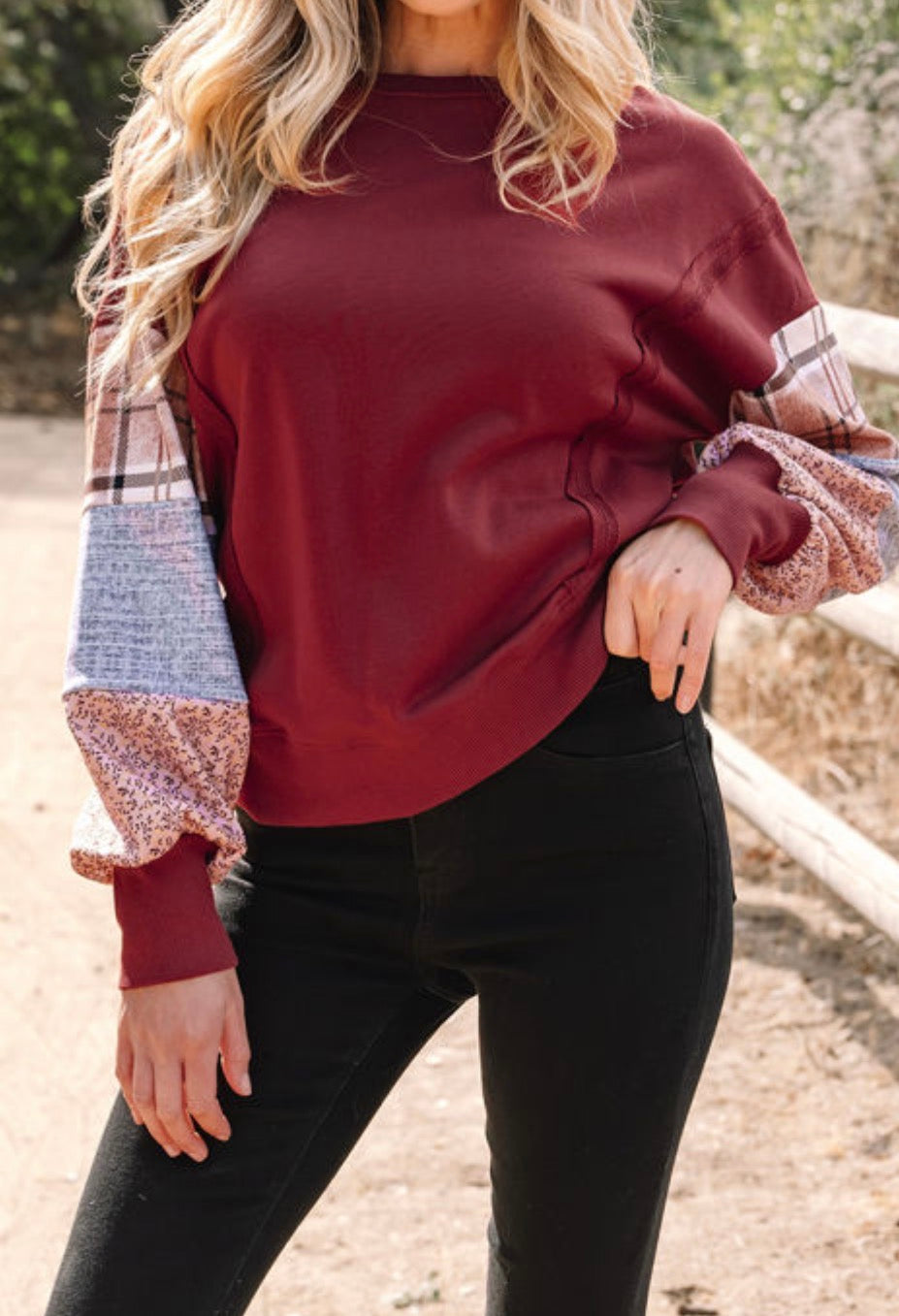 Red sweater with pattern sleeves